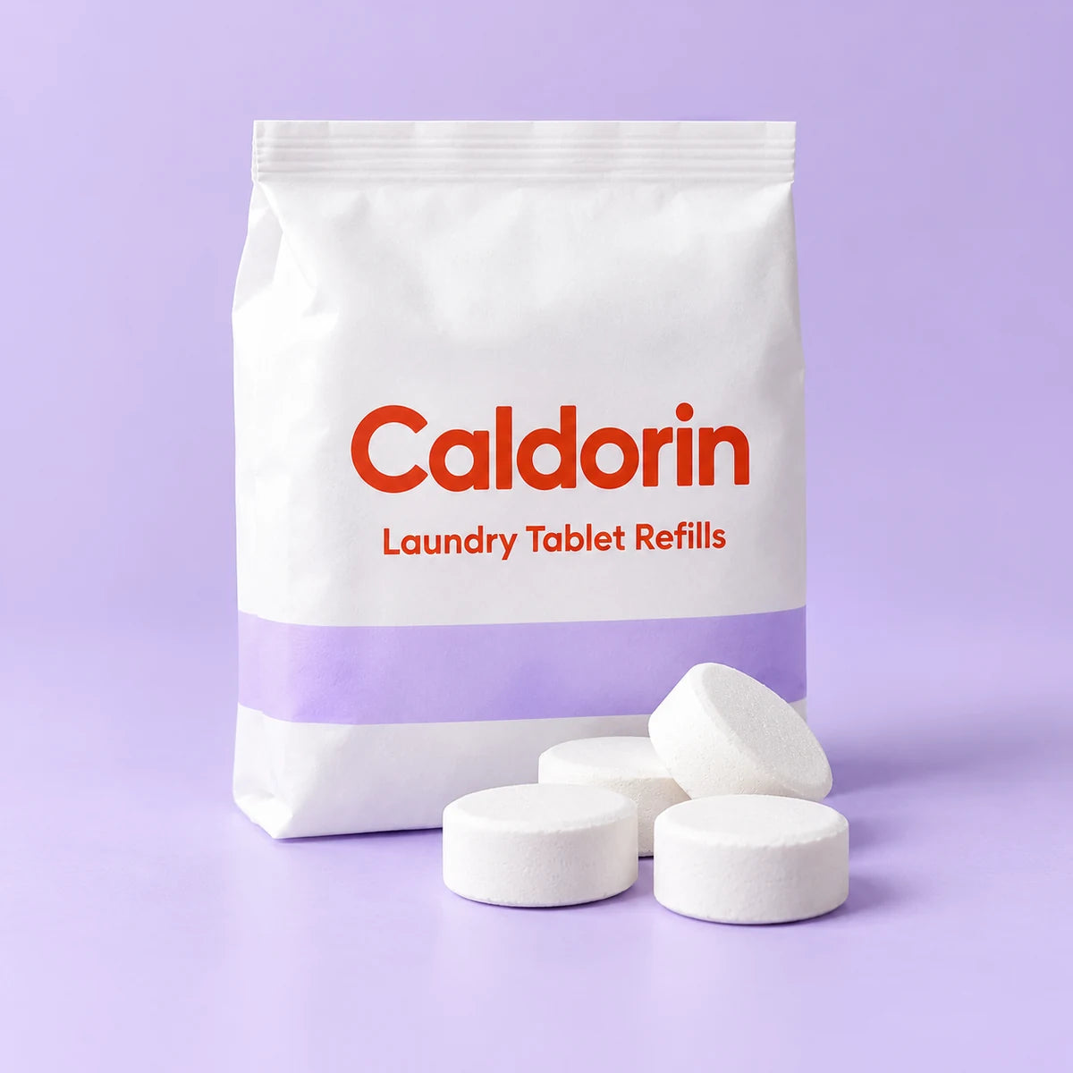 Caldorin Laundry Detergent Tablet Refills in a clean pale-blue and lilac studio setting